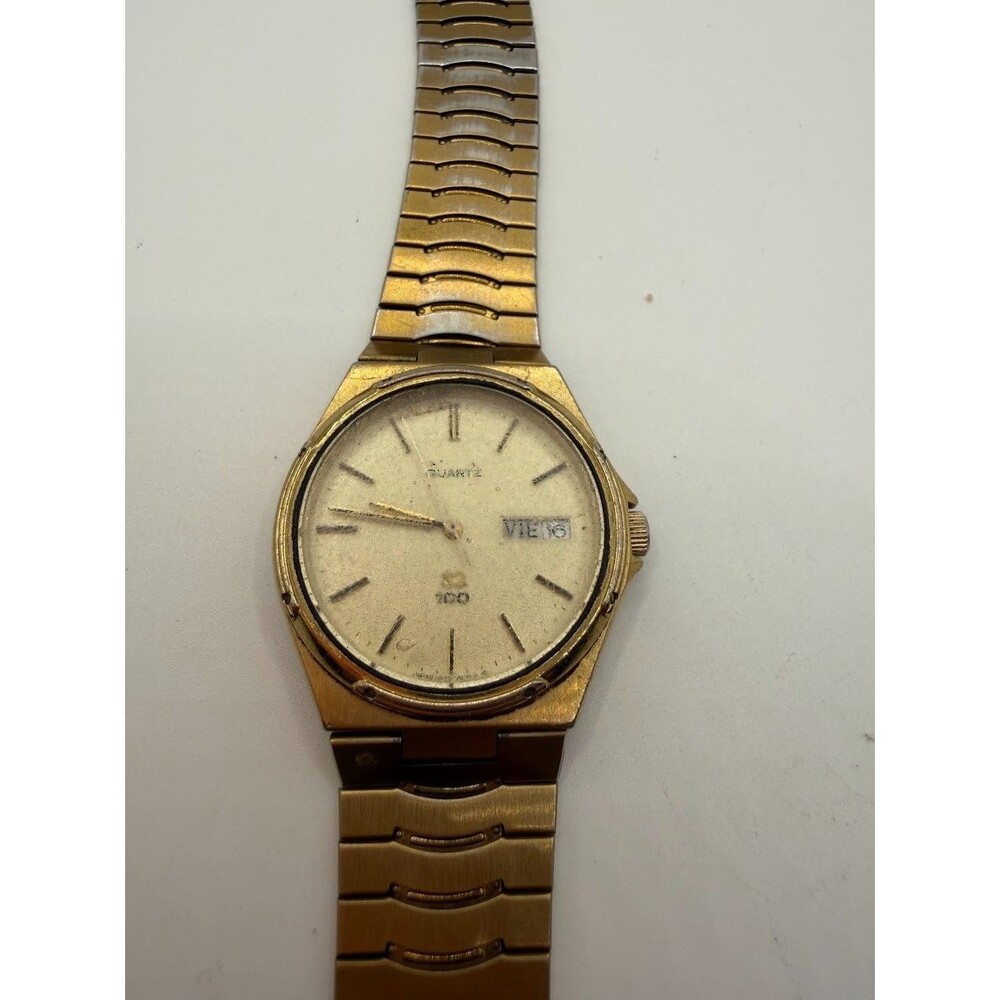 Vintage Seiko SQ 100 6923-7059 Gold Tone Watch English Spanish Day Date Runs
